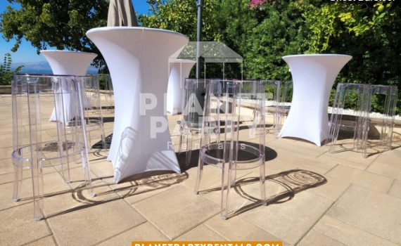 Clear Barstools with Wooden Cocktail Table and a White Spandex Tablecloth