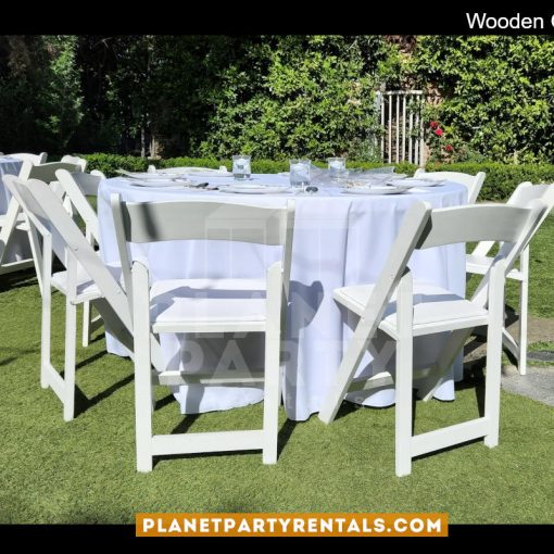 White Wooden Chairs with Round Table and Round White Tablecloth