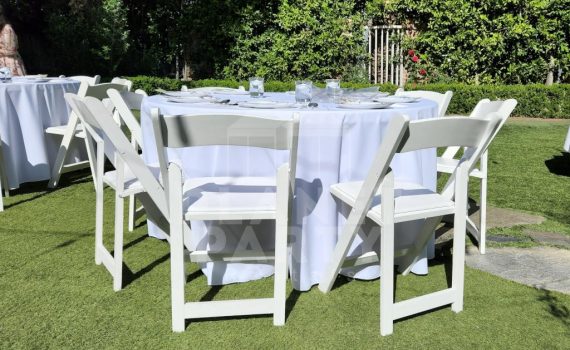 White Wooden Chairs with Round Table and Round White Tablecloth
